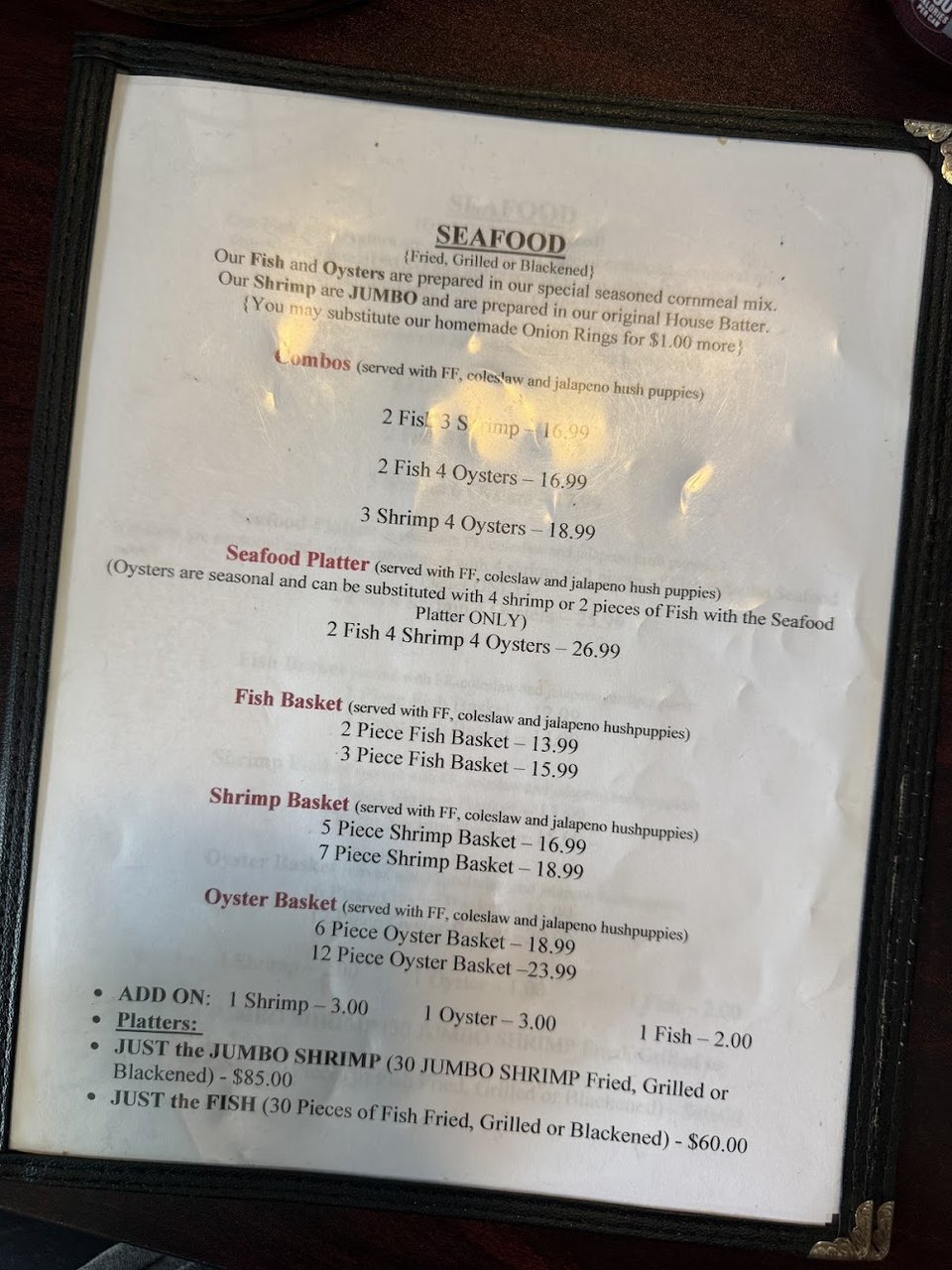Restaurant menu listing jerk chicken and platter choices.